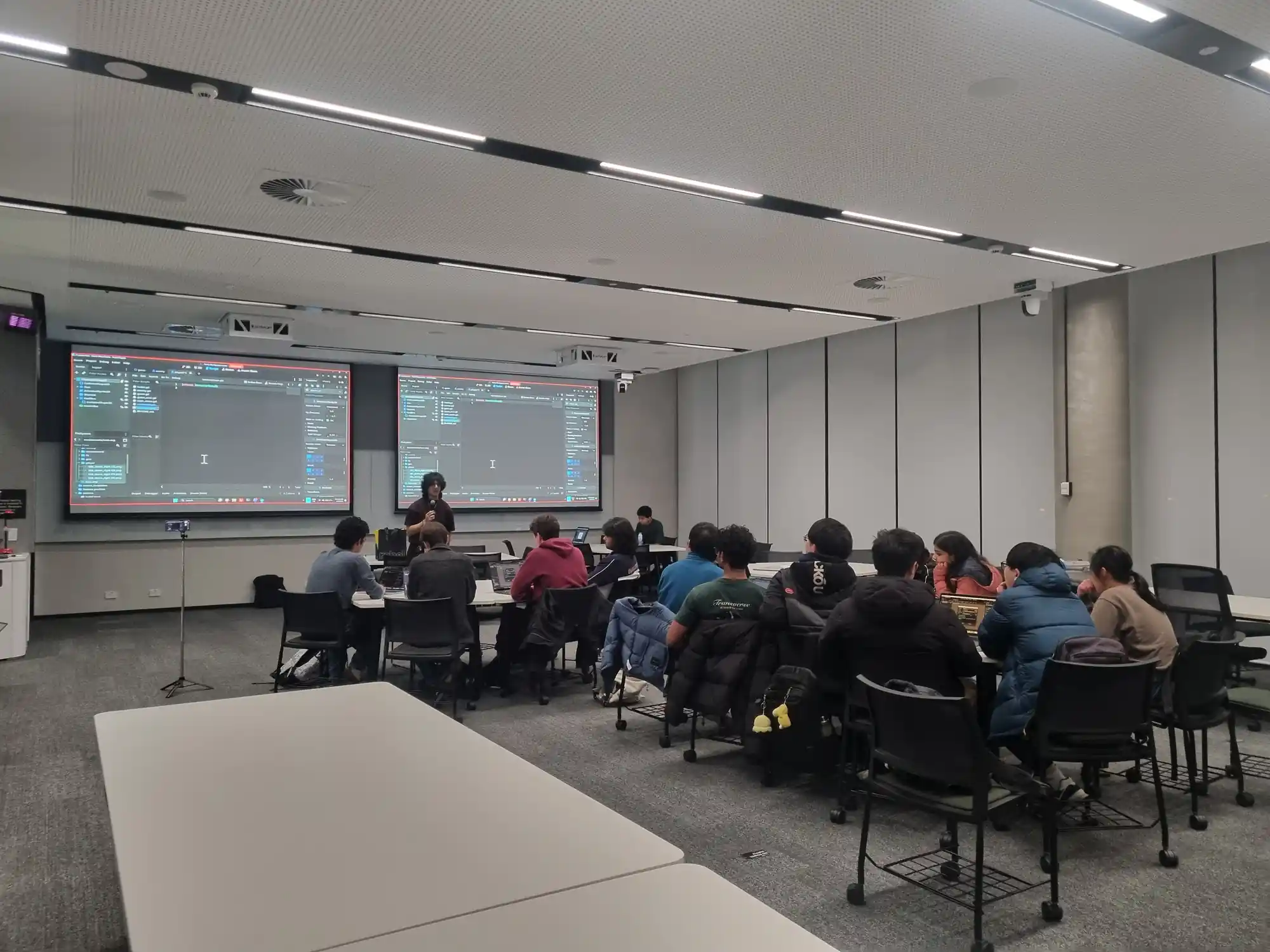 Attendees watching the game-dev demo