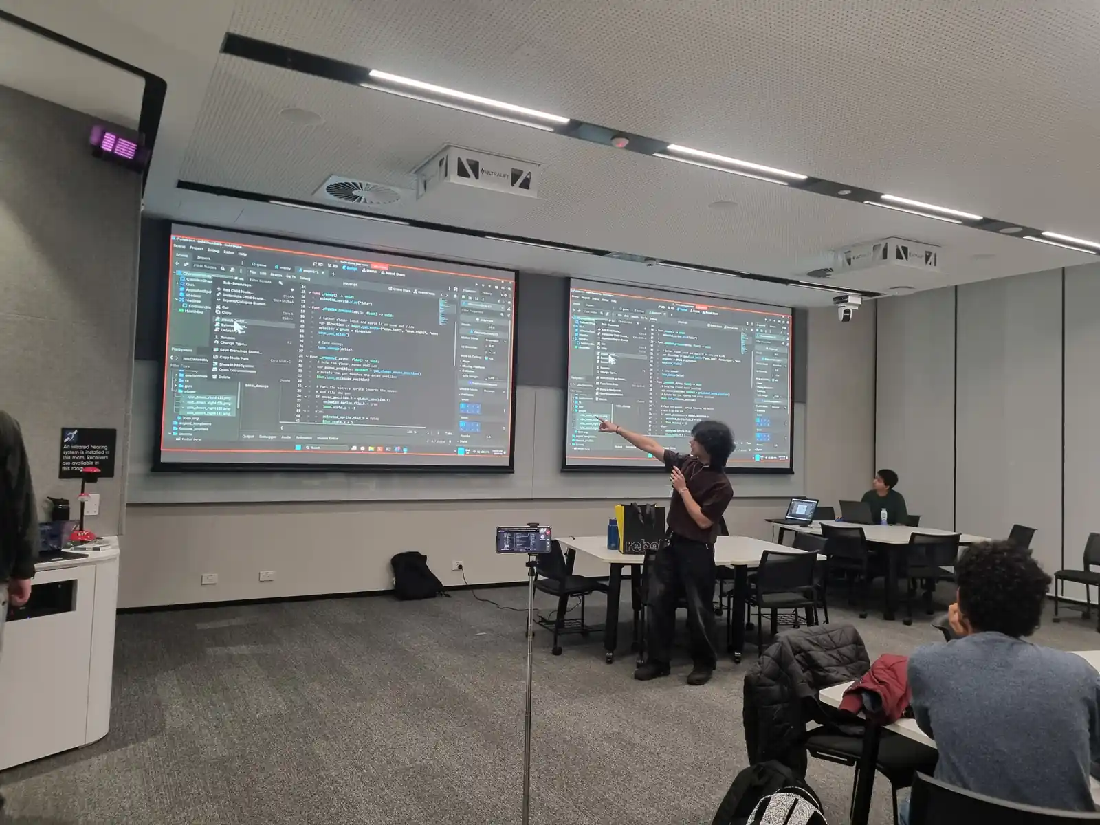 Presenter walking through live Godot code on the big screen