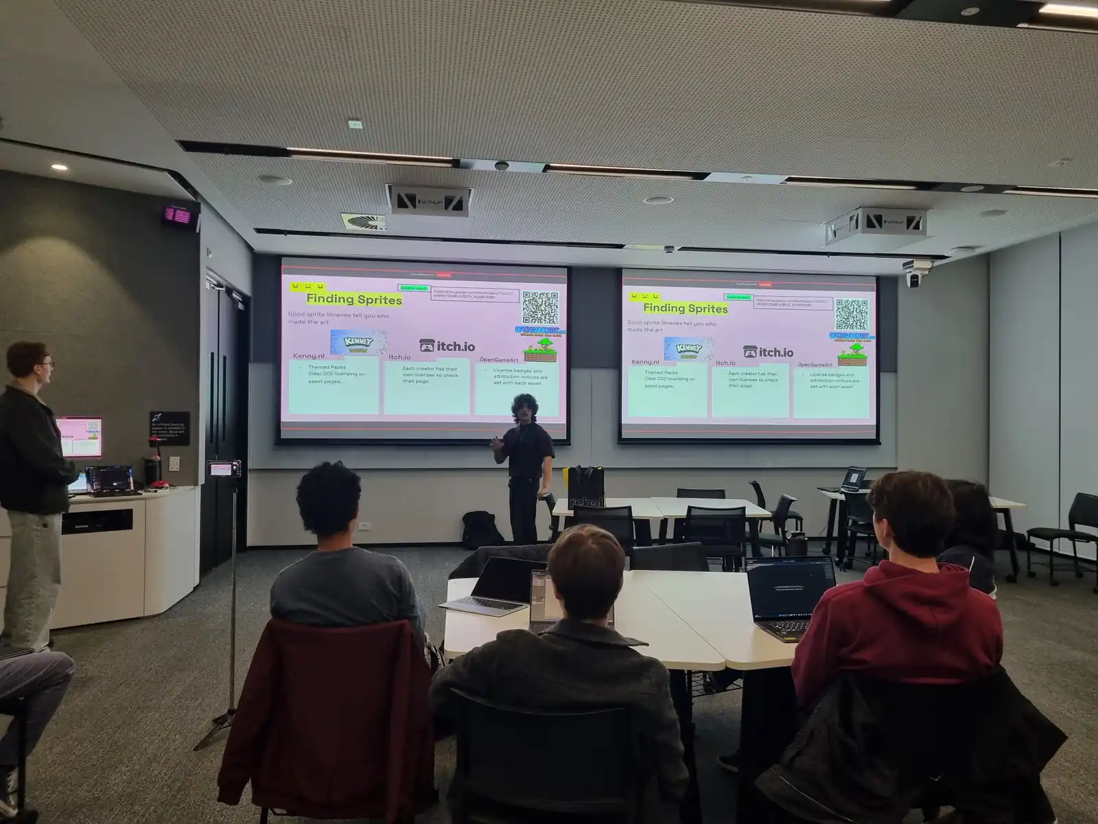 Two leads presenting to the workshop